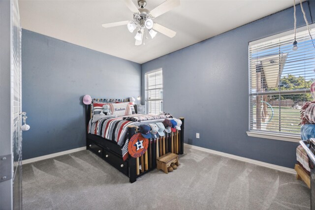 bedroom with ceiling fan and carpet floors