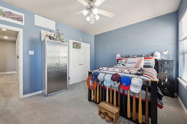 carpeted bedroom featuring ceiling fan