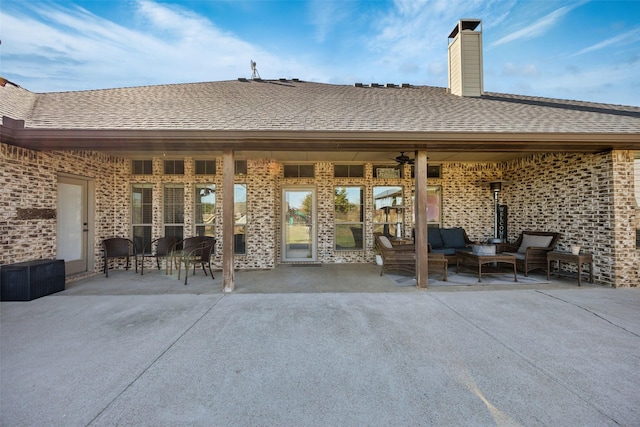 back of house featuring an outdoor hangout area and a patio