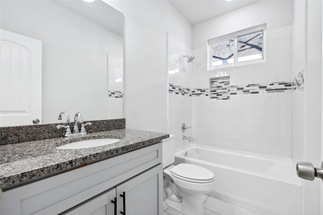 full bathroom with tiled shower / bath combo, toilet, and vanity