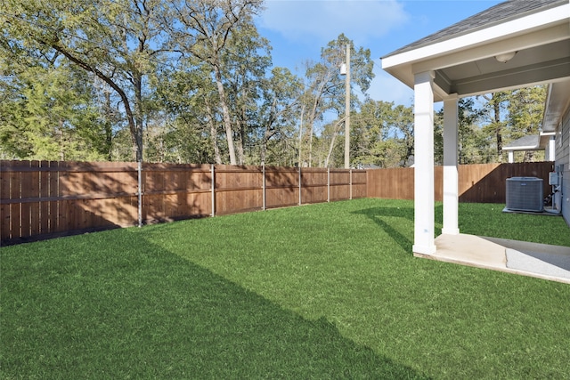 view of yard with central AC