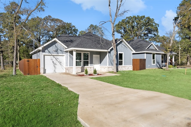 view of front of home featuring a garage and a front lawn