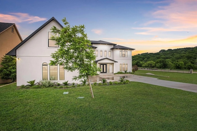 view of front of property with a lawn