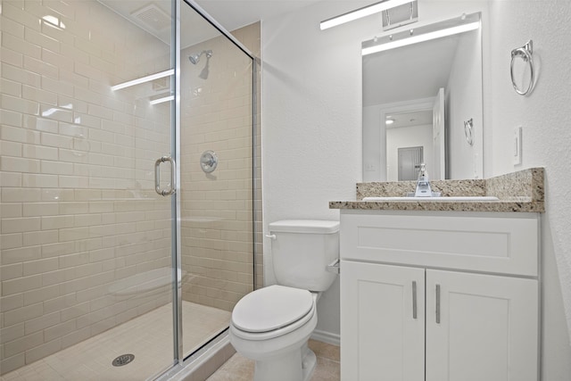 bathroom featuring walk in shower, tile patterned floors, vanity, and toilet