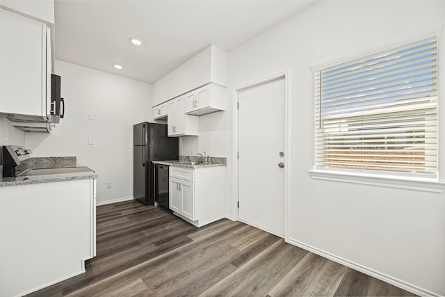 kitchen featuring white cabinets, dark hardwood / wood-style floors, and black appliances