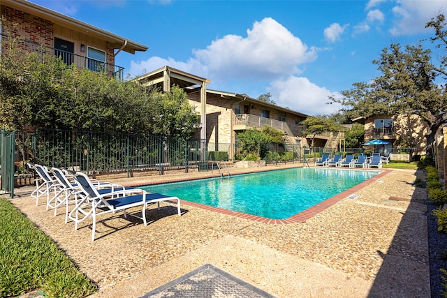 view of swimming pool with a patio area