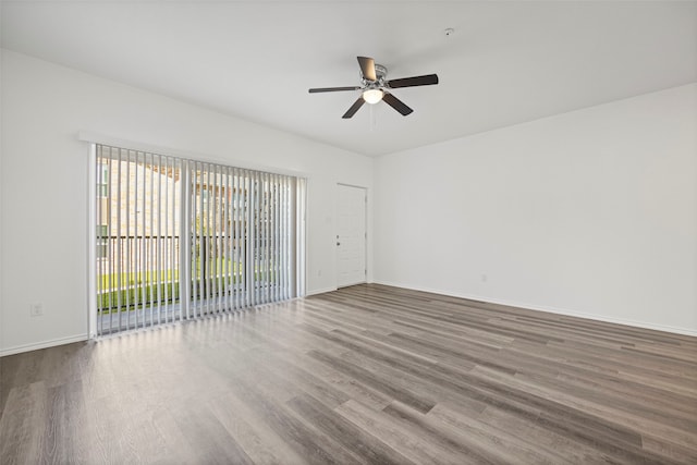 spare room featuring ceiling fan and hardwood / wood-style floors