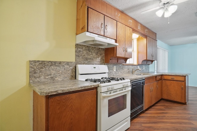 kitchen with dishwasher, sink, dark hardwood / wood-style floors, a textured ceiling, and white range with gas cooktop