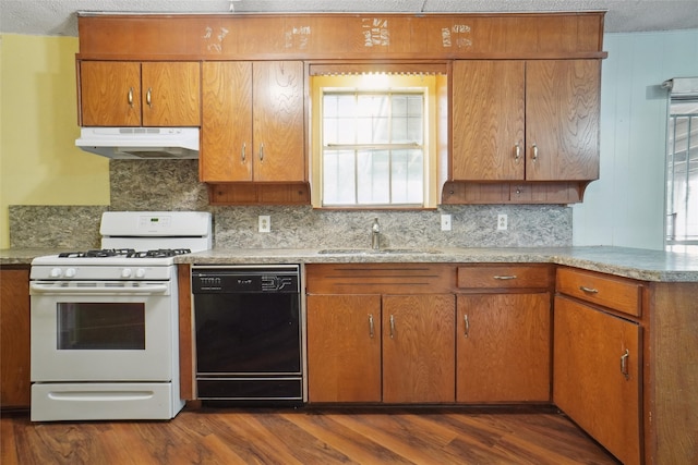 kitchen featuring backsplash, white range with gas cooktop, sink, black dishwasher, and dark hardwood / wood-style floors