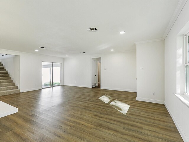 unfurnished room featuring hardwood / wood-style flooring and ornamental molding