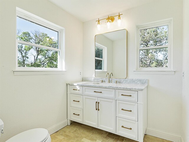 unfurnished room featuring a wealth of natural light and light carpet