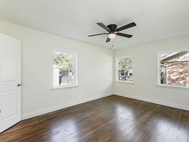 unfurnished room with ceiling fan, dark hardwood / wood-style flooring, and a wealth of natural light