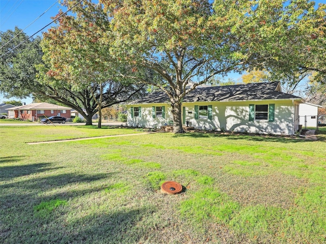 single story home with a front yard