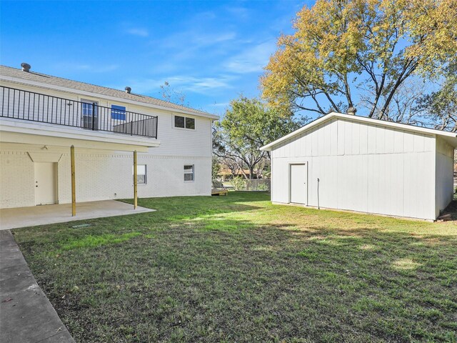 garage with a lawn and central AC unit