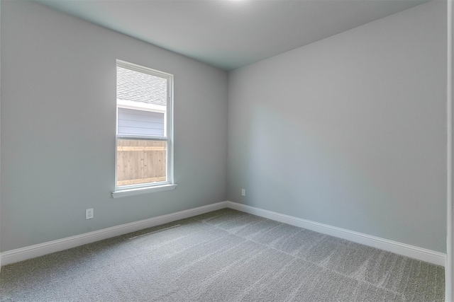 spare room featuring carpet flooring