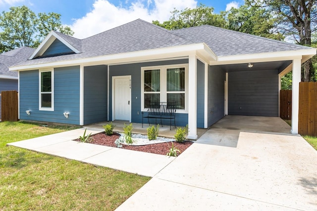 view of front of house with a carport and a porch