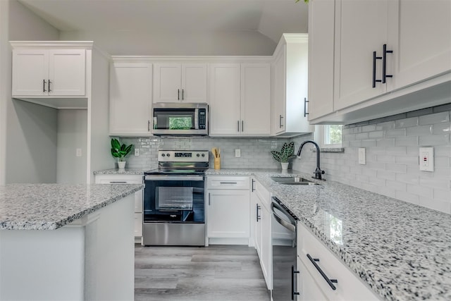 kitchen with white cabinetry, sink, and appliances with stainless steel finishes