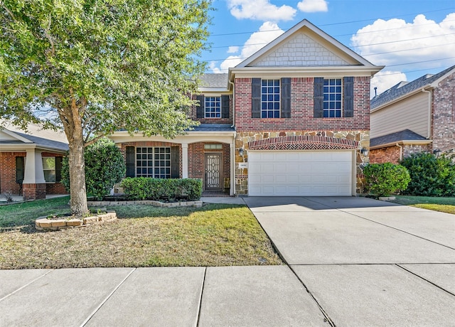 front of property featuring a garage and a front lawn