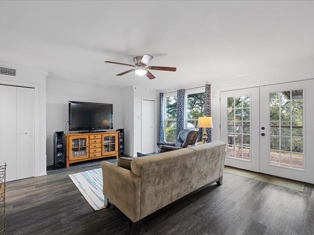 living room with ceiling fan, dark wood-type flooring, and french doors