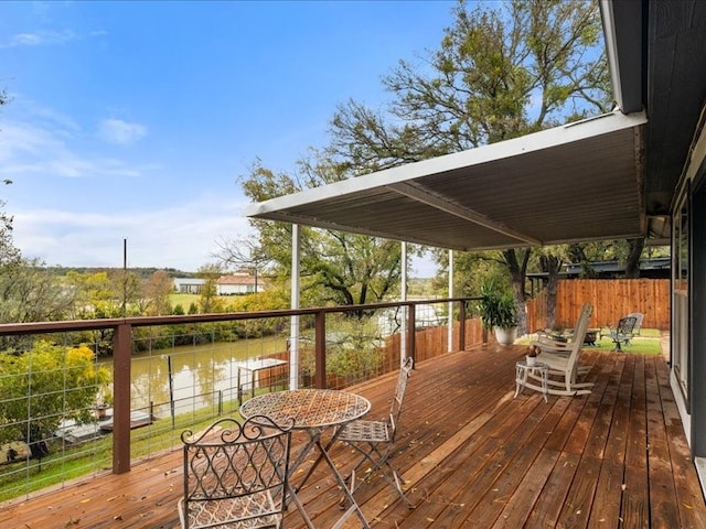 wooden terrace with a water view