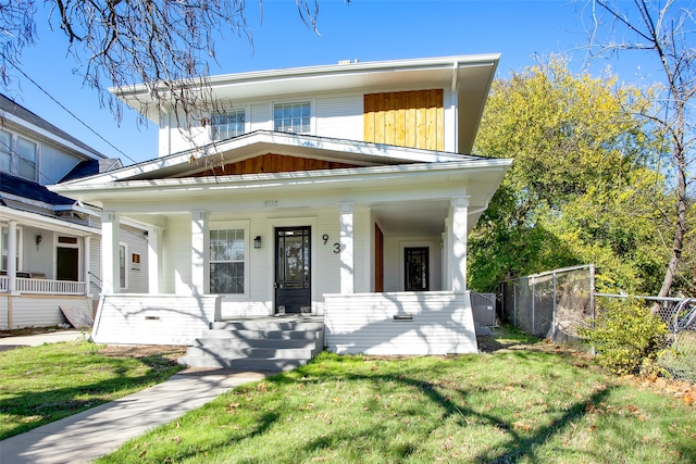 view of front of home featuring covered porch and a front yard