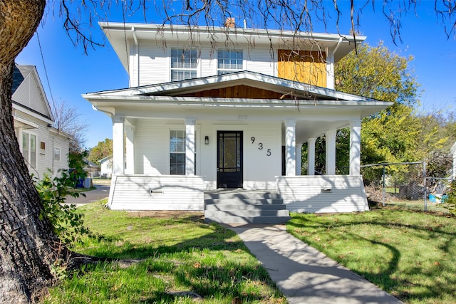 view of front of house featuring a front lawn and a porch