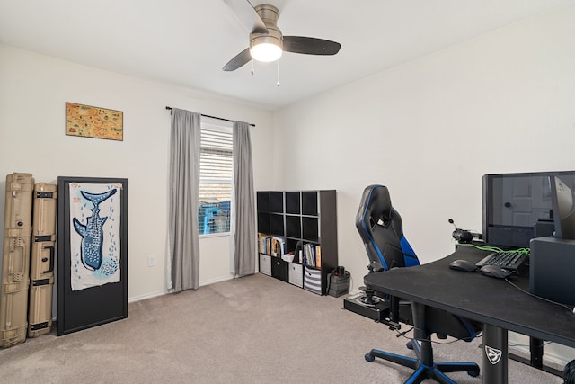 carpeted home office with ceiling fan