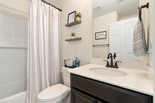 full bathroom featuring shower / bath combo, vanity, and toilet