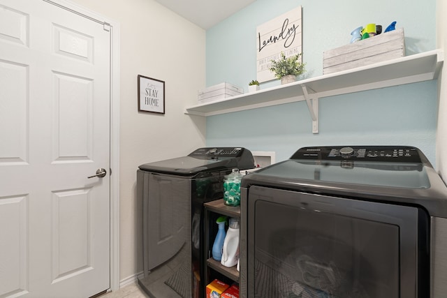 clothes washing area featuring washer and clothes dryer