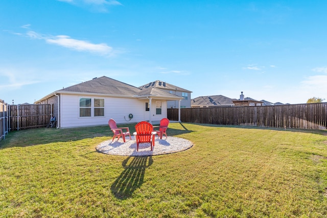 rear view of house with a yard