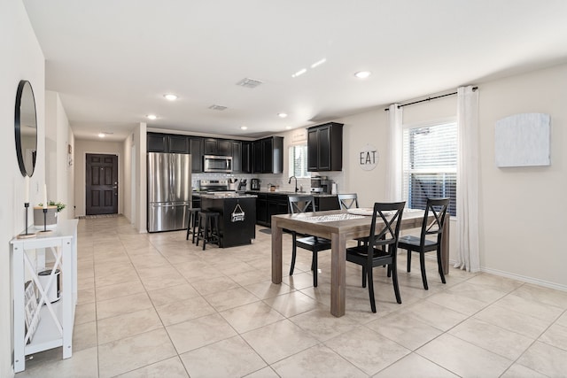 tiled dining area with sink