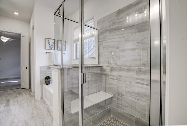 bathroom with ceiling fan and plus walk in shower