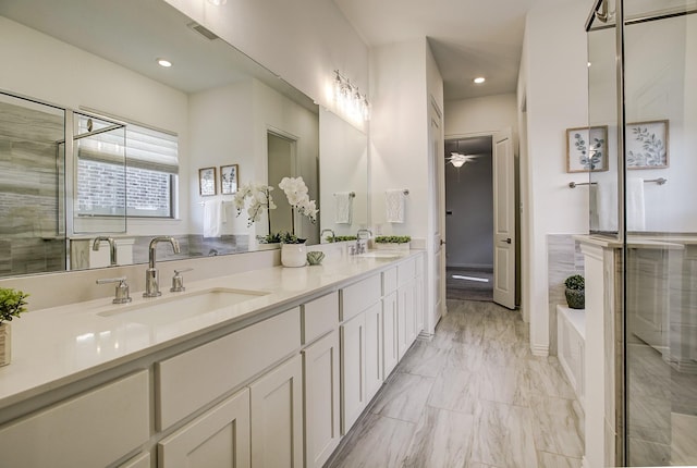 bathroom featuring vanity and shower with separate bathtub