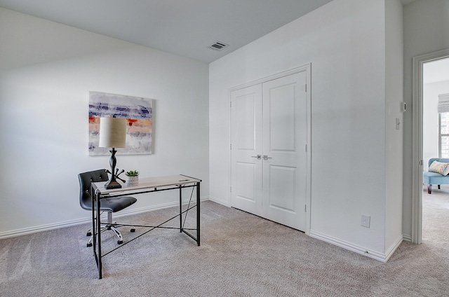 office area featuring light colored carpet