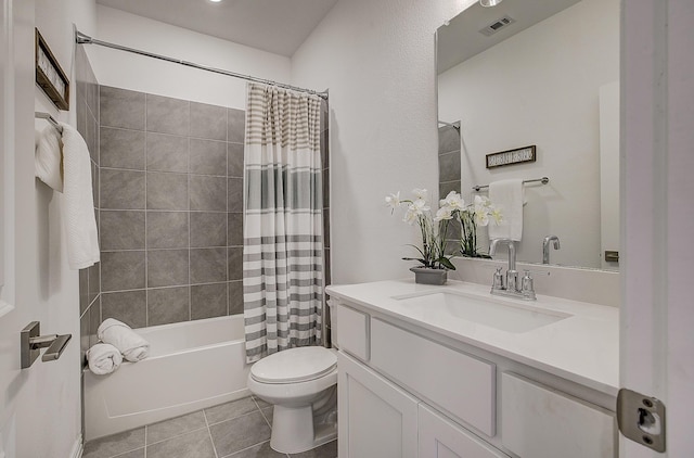 full bathroom featuring tile patterned flooring, vanity, toilet, and shower / tub combo with curtain