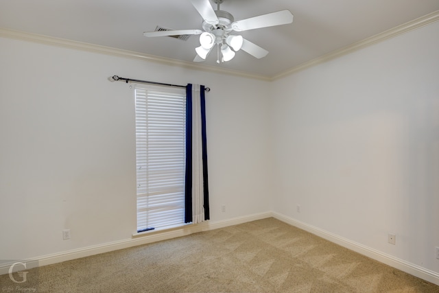 unfurnished room with ceiling fan, crown molding, and light colored carpet