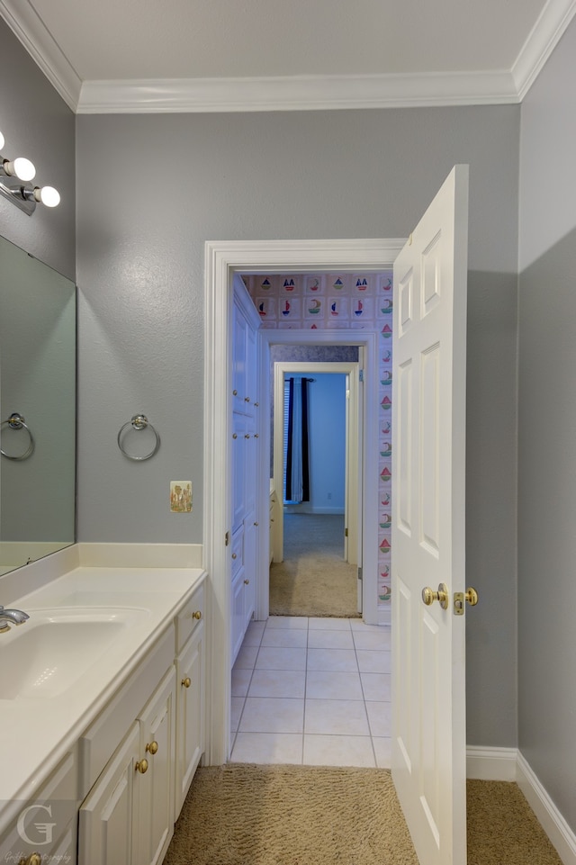 bathroom with ornamental molding, vanity, and tile patterned floors