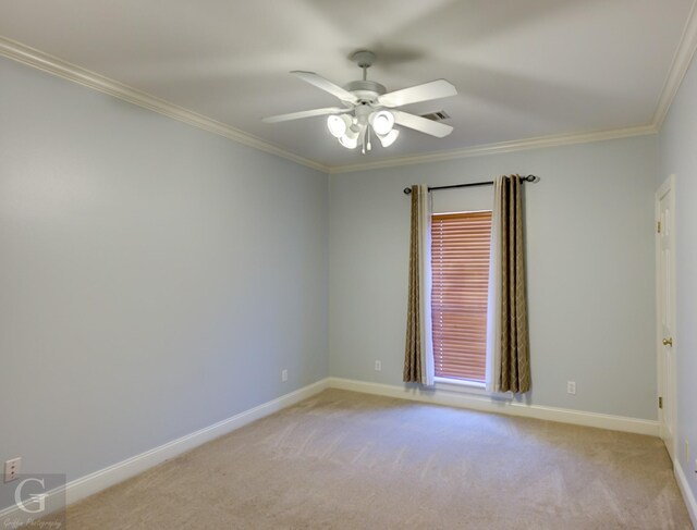 unfurnished bedroom featuring ceiling fan, ornamental molding, and light colored carpet