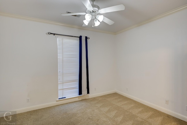 empty room with a raised ceiling, light carpet, ornamental molding, and a healthy amount of sunlight