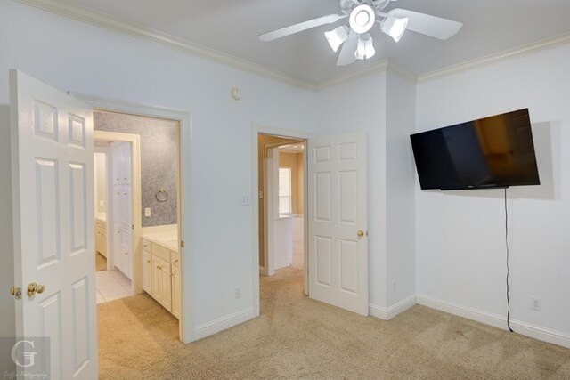 unfurnished bedroom featuring ceiling fan, ornamental molding, light carpet, and connected bathroom