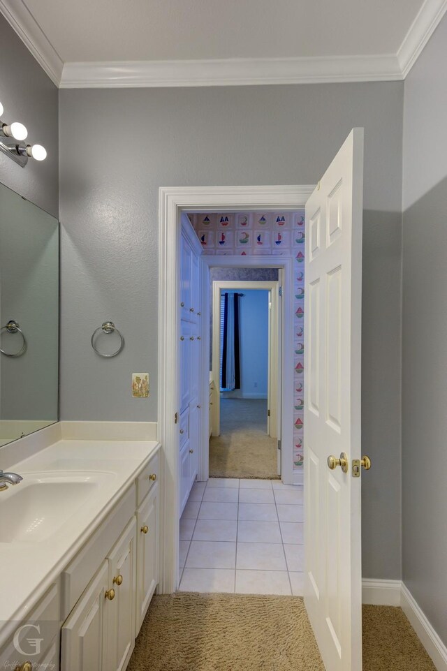 bathroom with vanity, crown molding, and tile patterned floors