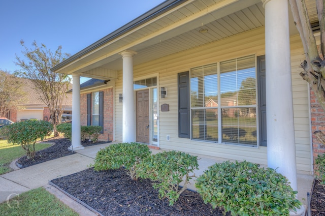 doorway to property with a porch