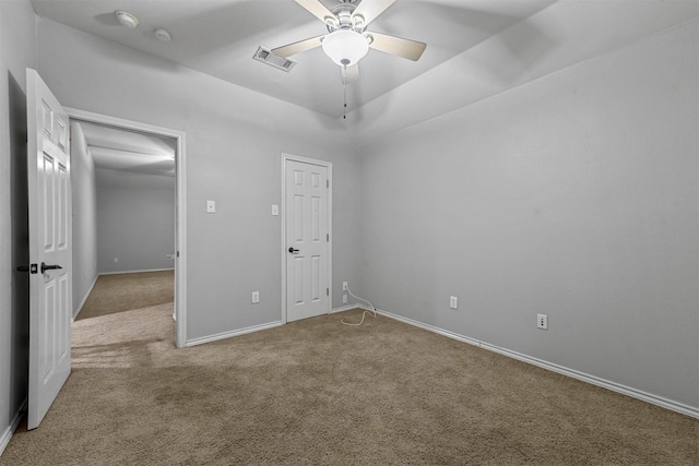 unfurnished bedroom with carpet floors, a closet, and ceiling fan