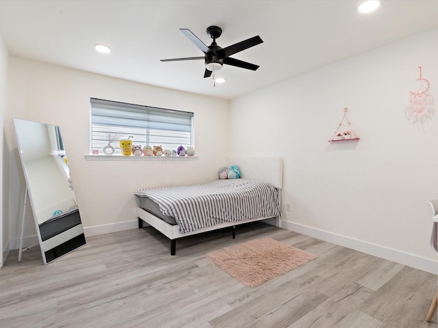 bedroom featuring light hardwood / wood-style flooring and ceiling fan