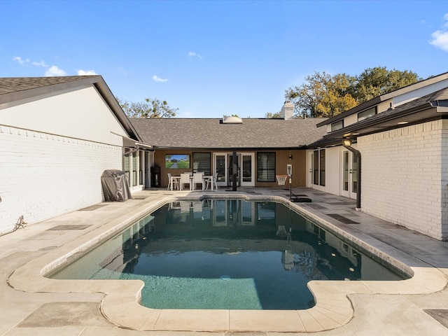 view of swimming pool with a patio area