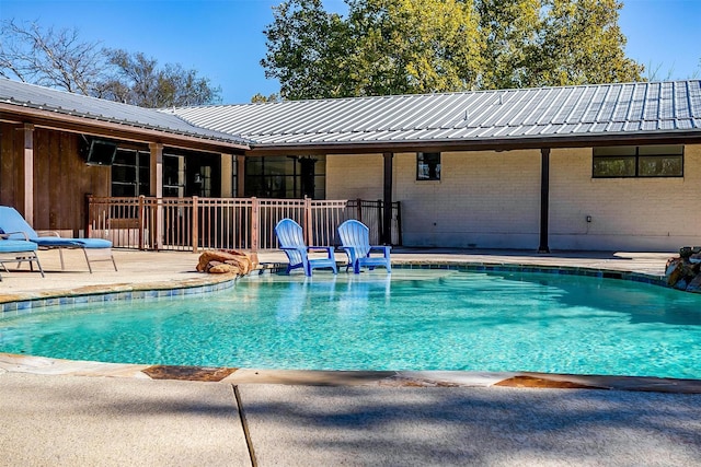 view of swimming pool featuring a patio