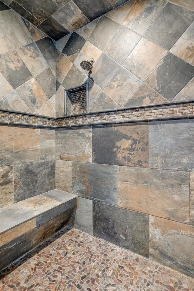 bathroom featuring wooden walls, toilet, and vanity