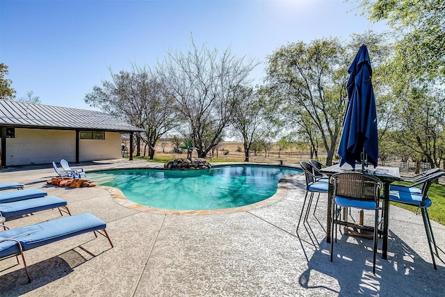 view of pool with a patio