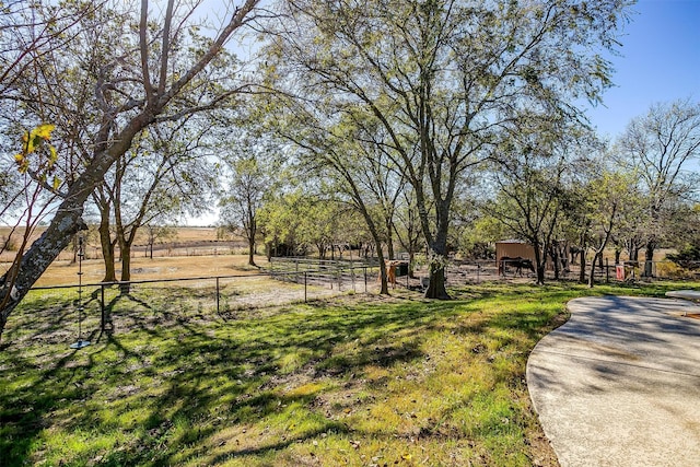 view of yard with a rural view