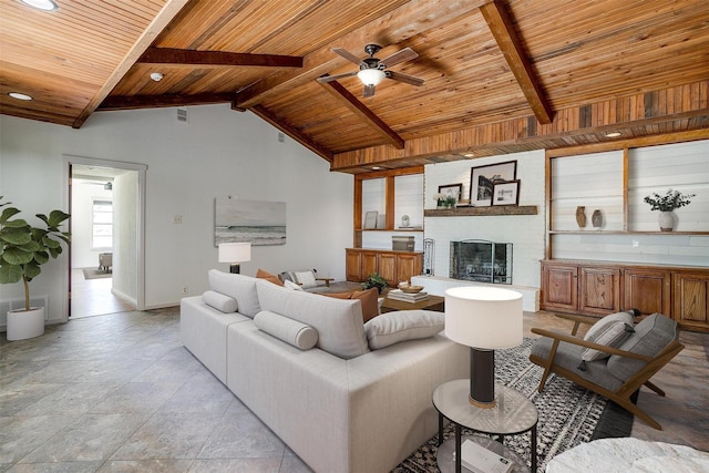 living room with ceiling fan, wood ceiling, and beamed ceiling